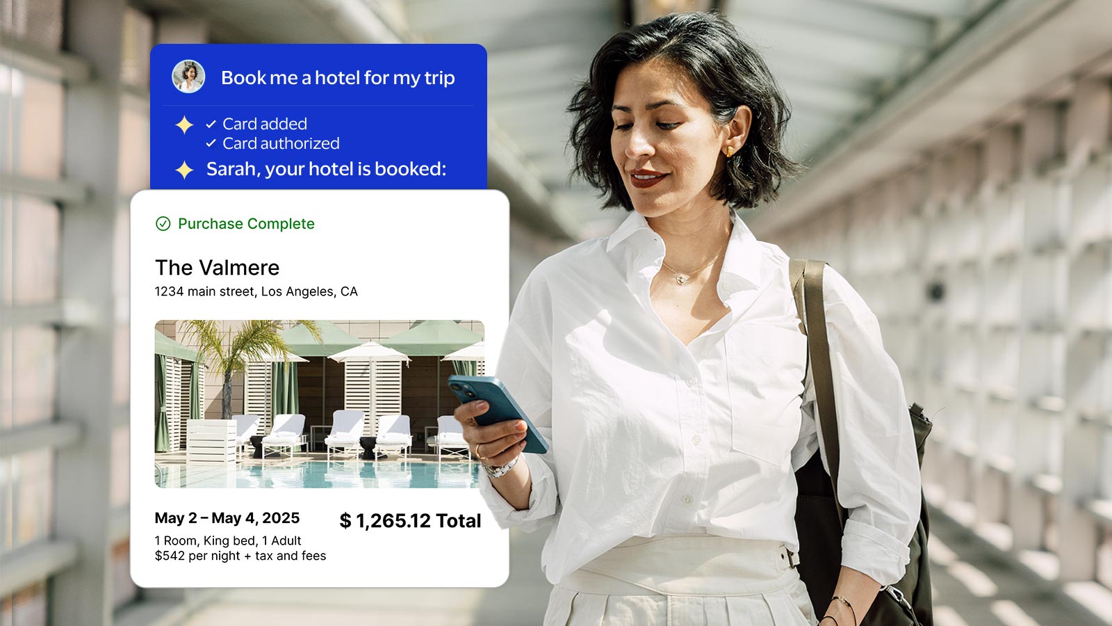 A woman interacting with an AI agent on her phone to book and pay for a hotel room for an upcoming trip.