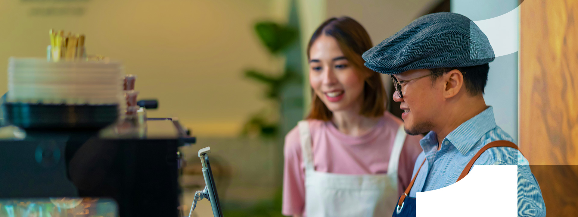 man and woman at shop desk