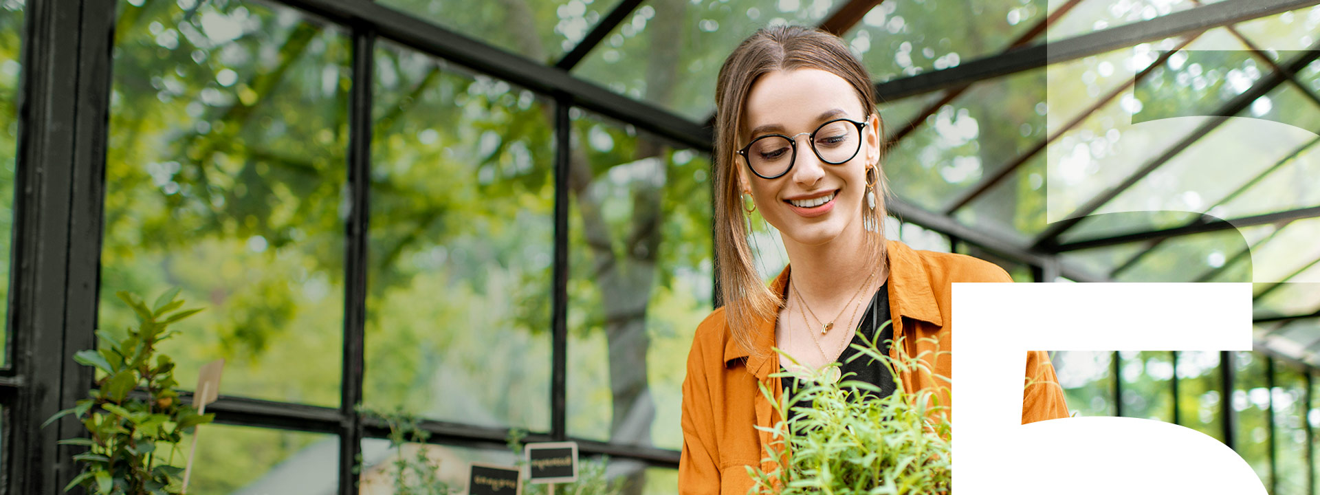 woman holding plant