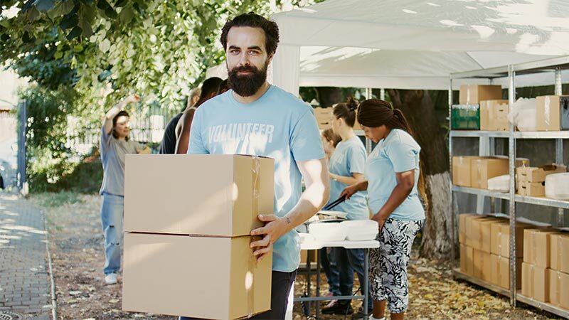 man moving boxes