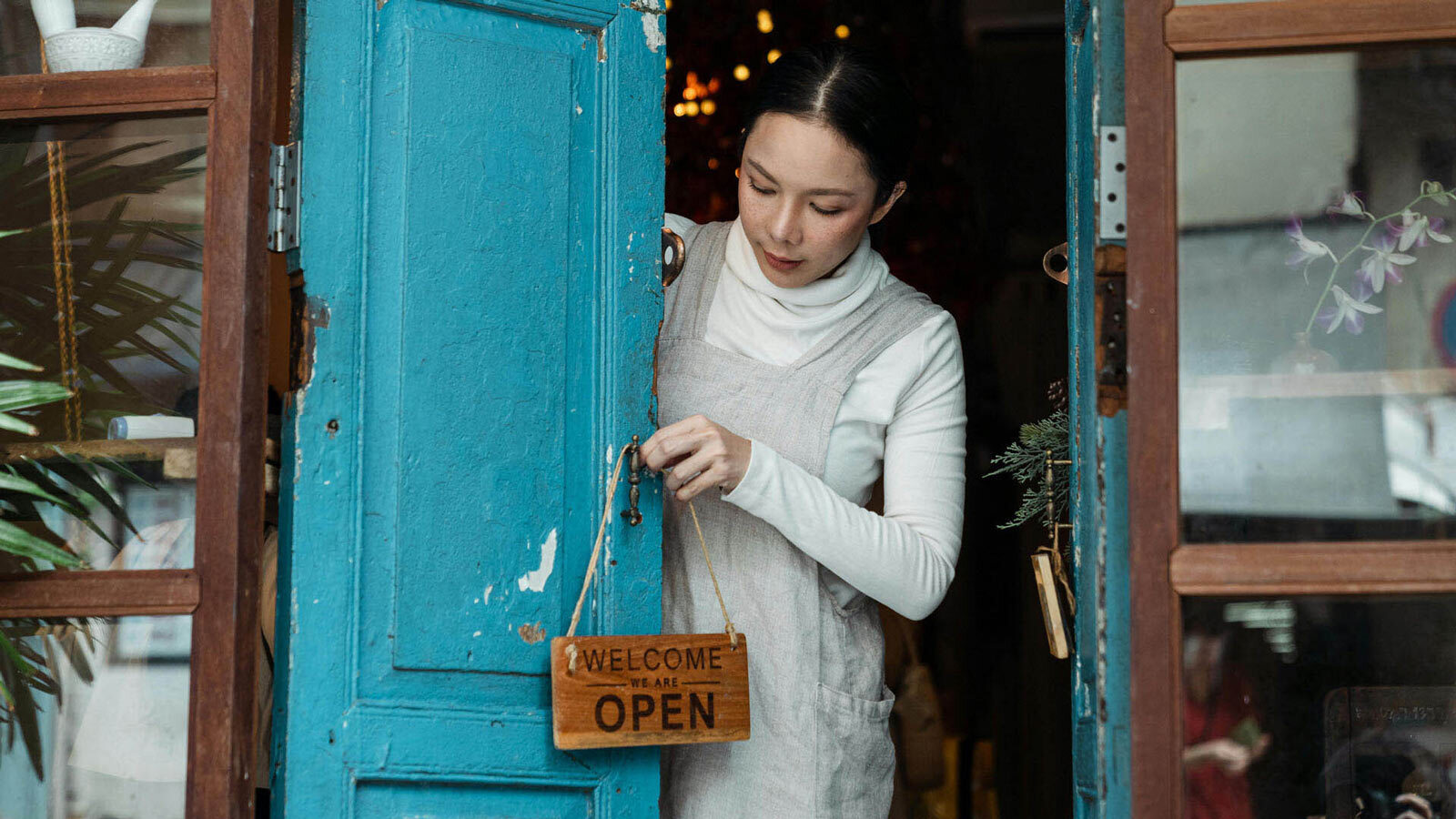 woman opening shop