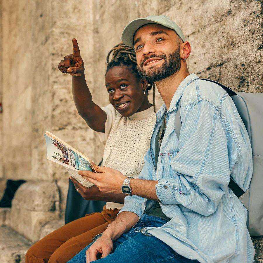 woman pointing and man looking