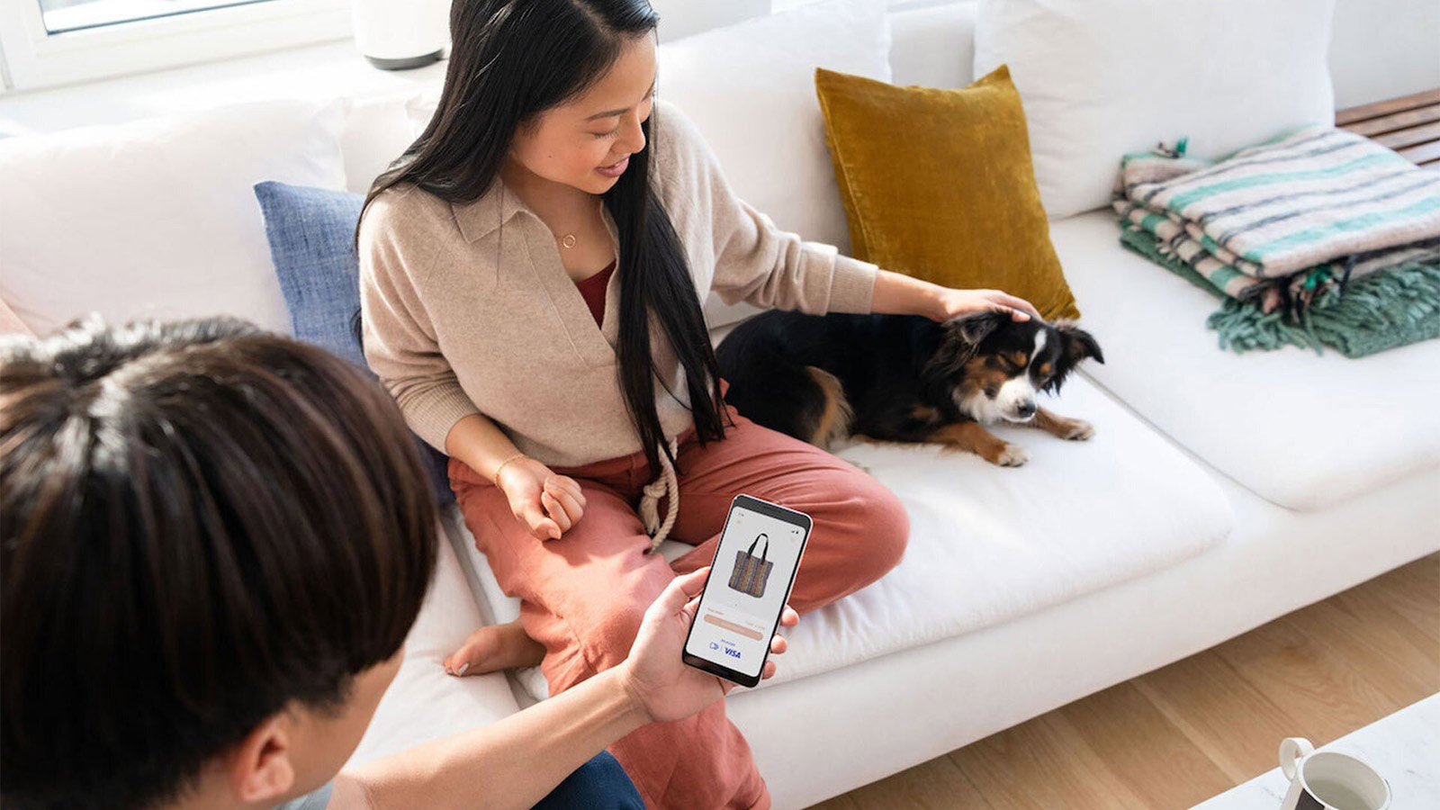 couple on sofa using mobile