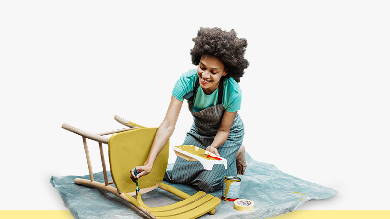 woman painting chair