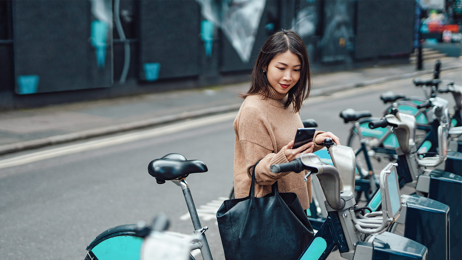 woman next to pushbikes