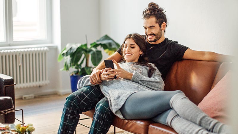 couple sat on sofa