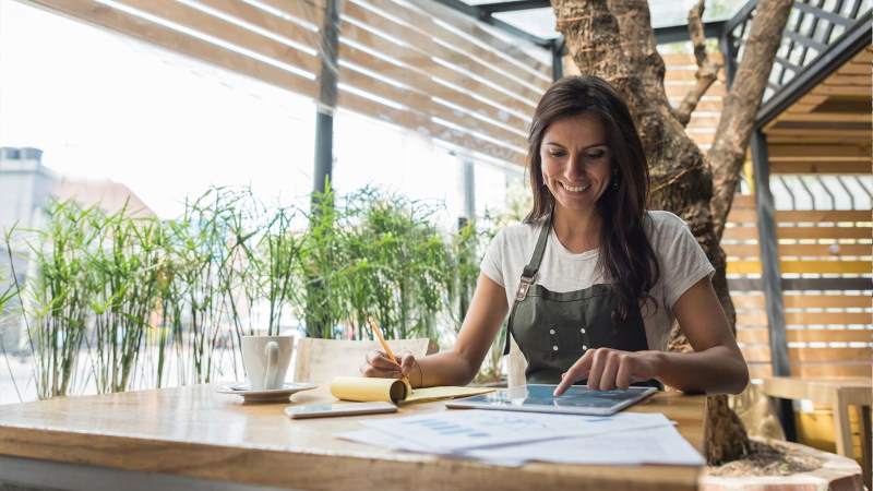 Person Sitting At desk using tablet